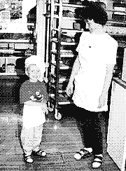 Little me in a tiny baker’s hat, grinning next to my mum between the bread racks of my parents’ bakery.